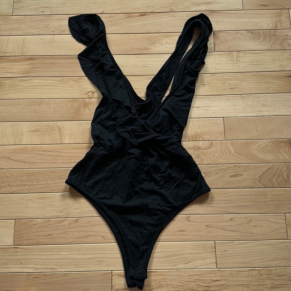 by the way. -Ruffled cotton bodysuit in small- snap bottom. Worn once